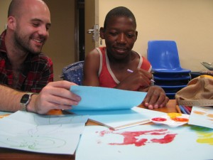 Steve working with a young boy